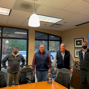 Tracy Bailey Passes the Ball to Rob Mayo at White Construction Company